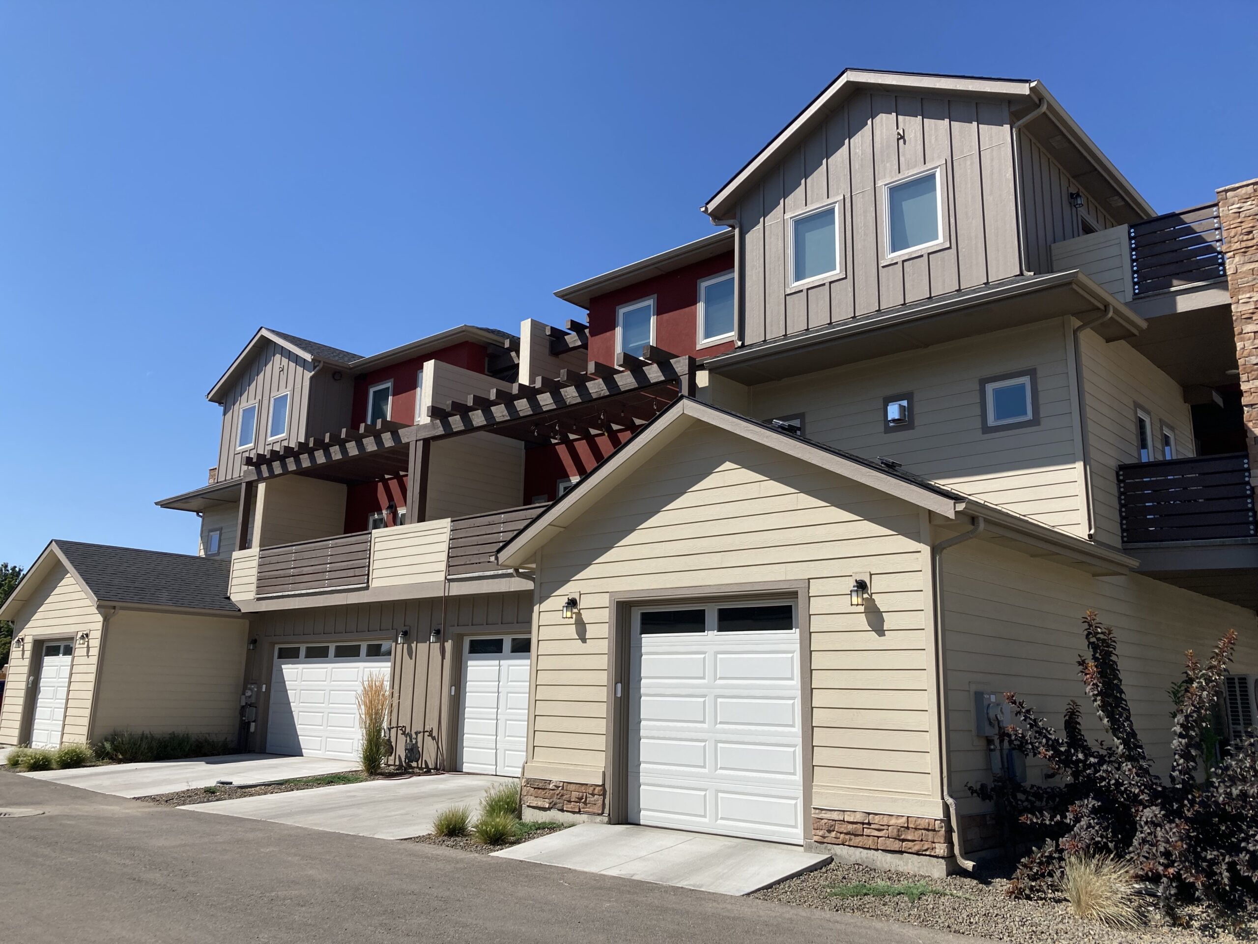 Two-story duplex condos with garages.